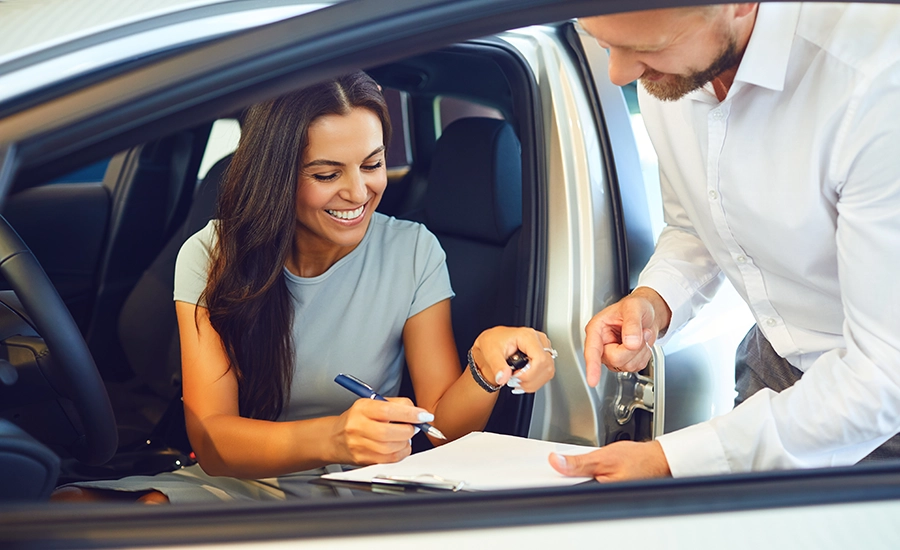 woman buying new car